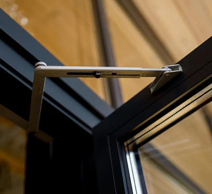 Modern Door Hinge on a Glass Door